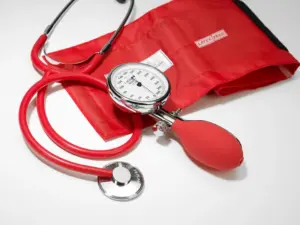 Blood pressure monitor Prakticus glossy red with stethoscope F. Bosch